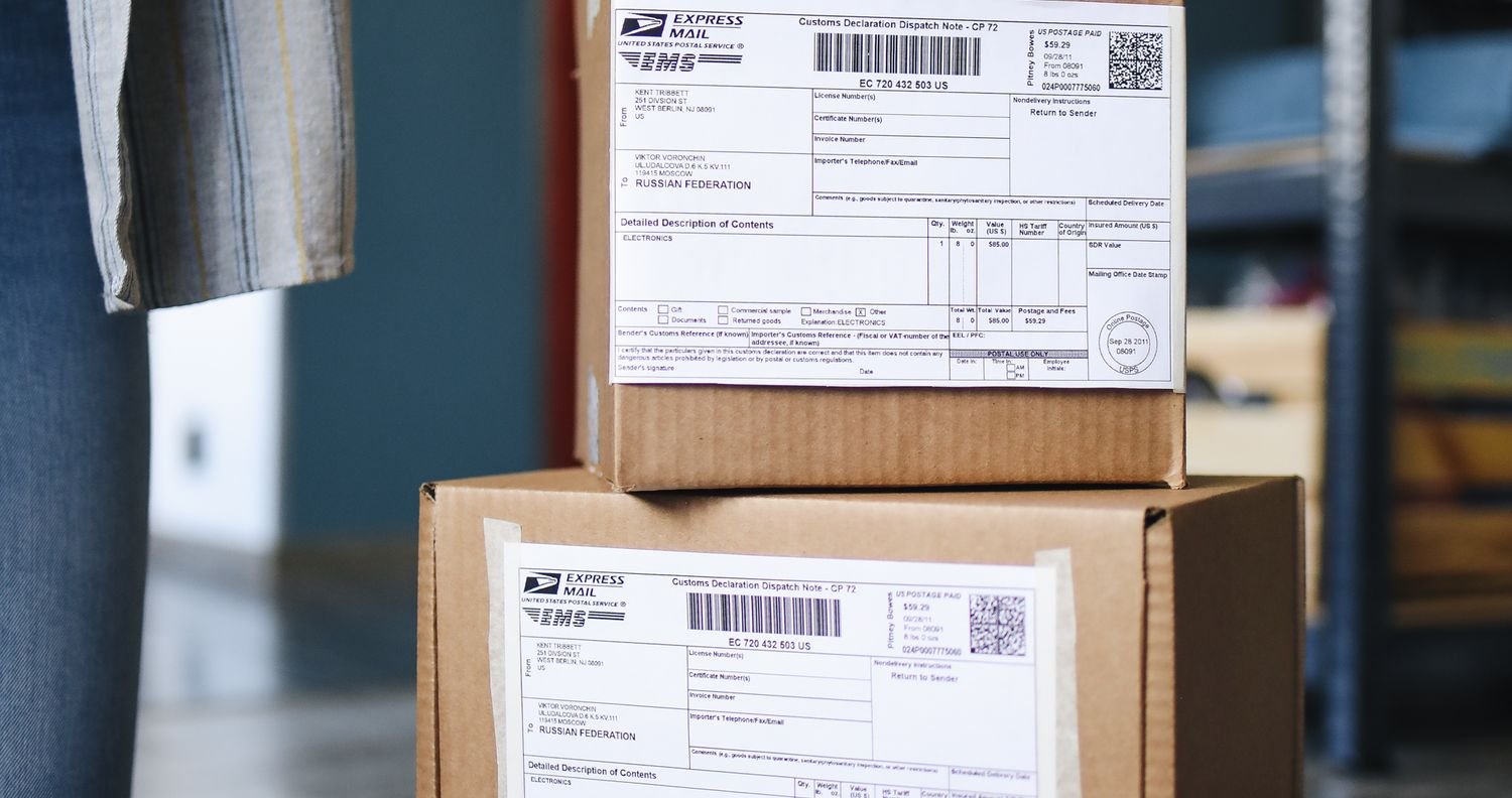 Cardboard parcels with printed shipping labels ready to ship